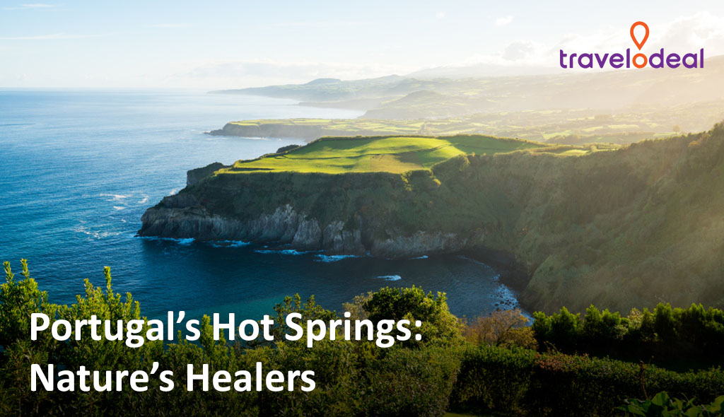 Scenic view of Portugal’s coastline, showcasing lush green cliffs meeting the ocean, highlighting the tranquility of natural hot springs.