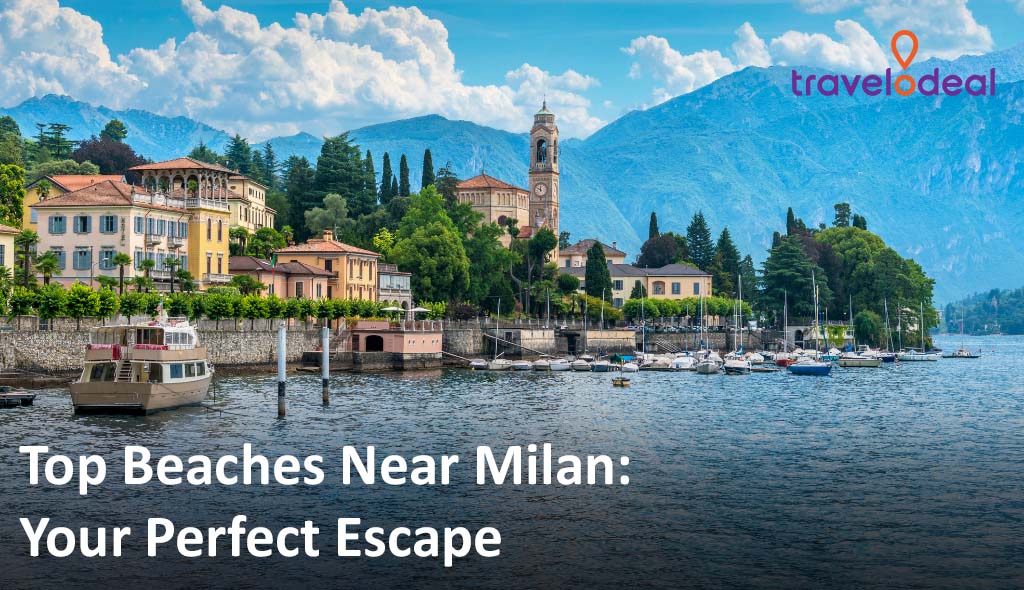 Scenic lakeside village near Milan with boats docked along the shore, charming villas, lush greenery, and mountains in the background under a clear blue sky.
