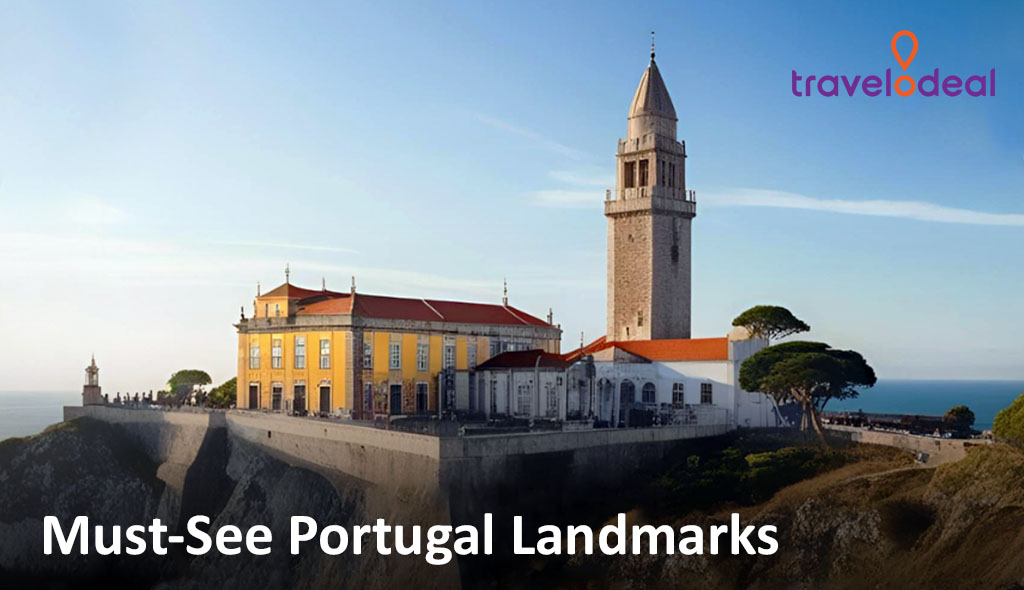 A scenic view of a historic yellow building with a tower on a cliff, overlooking the sea, featured as a must-see Portugal landmark.