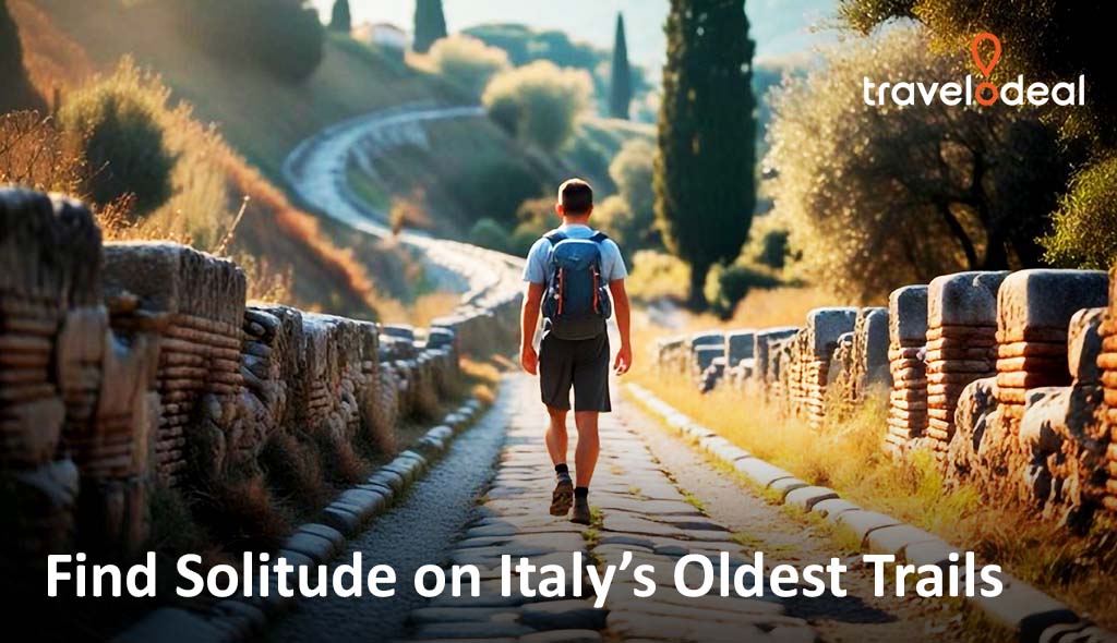 A hiker walks along a winding, ancient trail in Italy, surrounded by lush greenery and historical stonework, seeking solitude in nature.